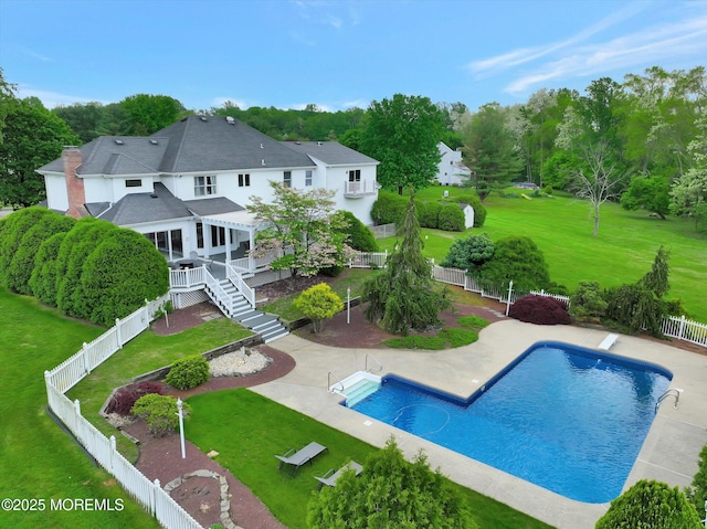 back of property featuring a patio, view of scattered trees, and a pergola