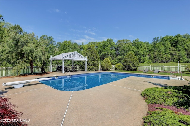 view of pool with a gazebo, a diving board, a patio, and a fenced backyard