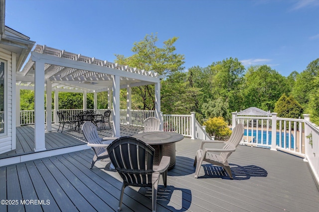 wooden deck featuring a pergola and outdoor dining area