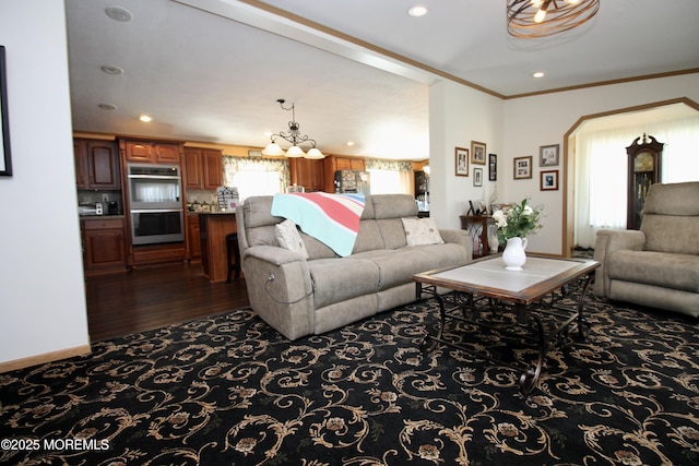 397 Finch Way, Freehold, NJ 07728 - living area with crown molding, arched walkways, dark wood-style floors, a chandelier, and recessed lighting