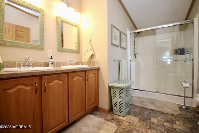 397 Finch Way, Freehold, NJ 07728 - bathroom with stone finish floors, a stall shower, double vanity, and baseboards