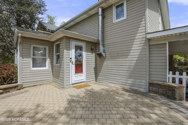 rear view of property featuring a patio area