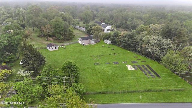 aerial view with a rural view and a wooded view