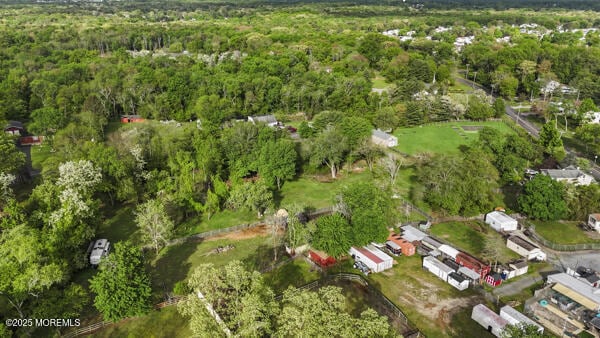 view of property location featuring a heavily wooded area