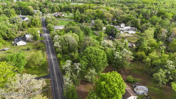 aerial overview of property's location with a forest