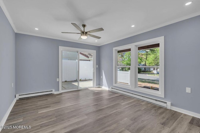 829A Westminster Ct, Manchester, NJ 08759 - unfurnished room featuring a baseboard heating unit, ornamental molding, and a wealth of natural light