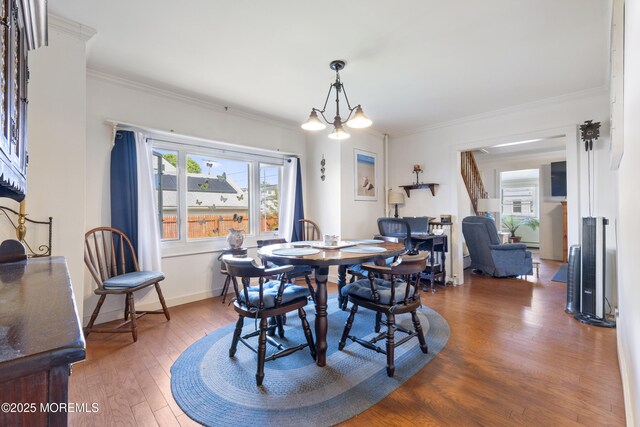 39-43 Twilight Ave, Keansburg, NJ 07734 - dining area with baseboards, ornamental molding, and wood finished floors