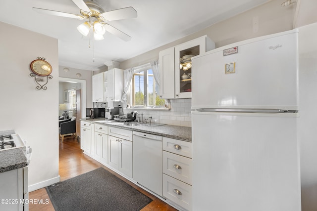 39-43 Twilight Ave, Keansburg, NJ 07734 - kitchen with light wood finished floors, a ceiling fan, white appliances, white cabinetry, and backsplash