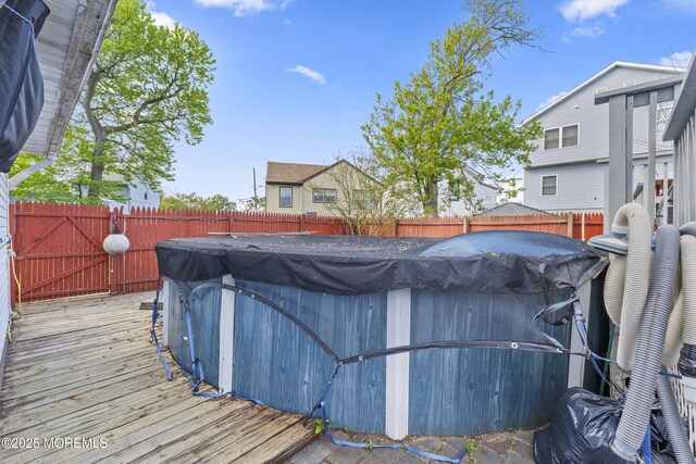 39-43 Twilight Ave, Keansburg, NJ 07734 - view of swimming pool featuring a swimming pool, a wooden deck, and a fenced backyard