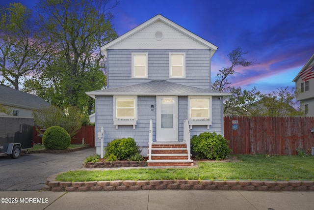 39-43 Twilight Ave, Keansburg, NJ 07734 - view of front of home featuring a lawn, roof with shingles, fence, and entry steps