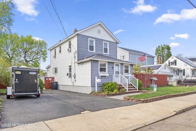 39-43 Twilight Ave, Keansburg, NJ 07734 - traditional-style house with fence and a chimney