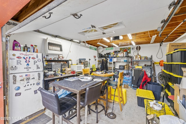 39-43 Twilight Ave, Keansburg, NJ 07734 - interior space with freestanding refrigerator, heating unit, a workshop area, and a garage door opener
