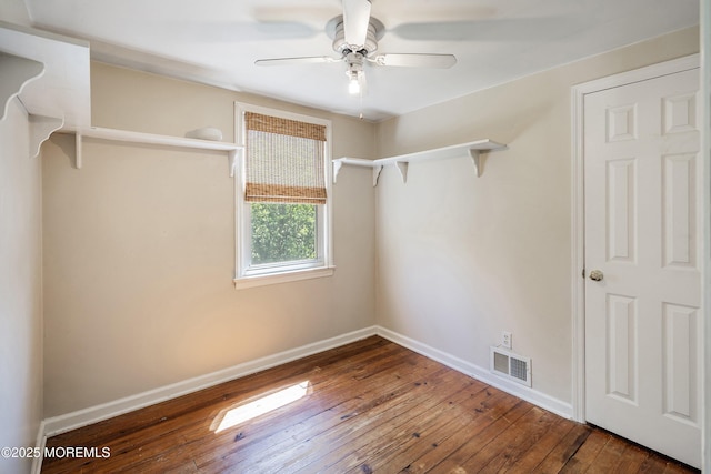 spacious closet with ceiling fan and hardwood / wood-style floors