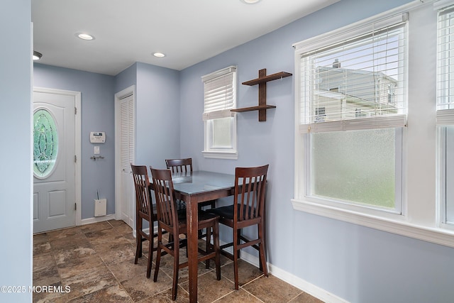 dining space with baseboards and recessed lighting