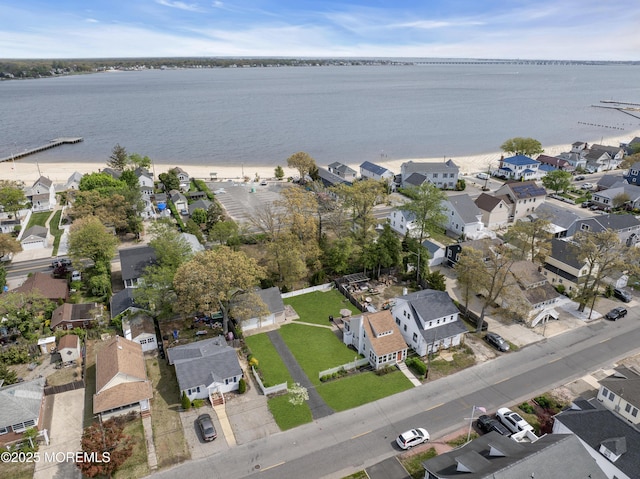 birds eye view of property with a residential view and a water view