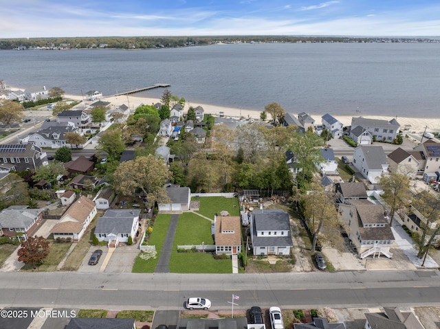 aerial view featuring a water view and a residential view
