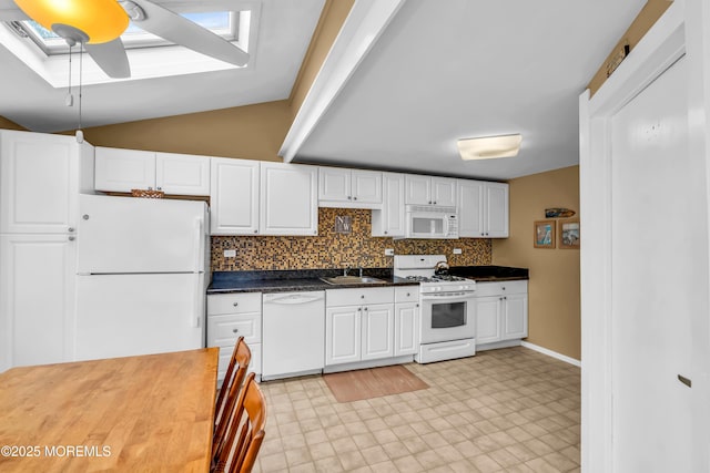 kitchen with ceiling fan, backsplash, white cabinets, and white appliances