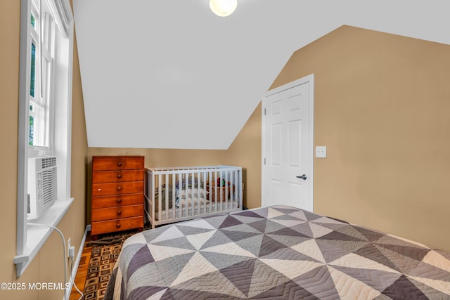 bedroom featuring lofted ceiling