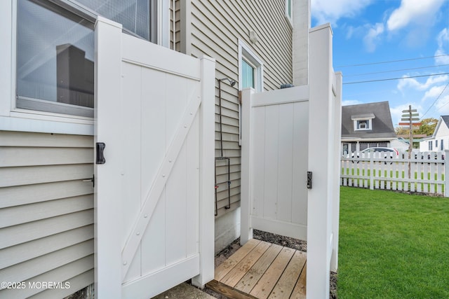 doorway to property featuring a yard