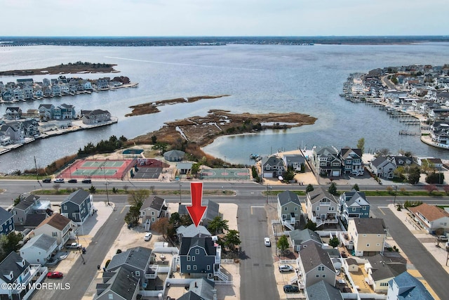 birds eye view of property featuring a water view and a residential view