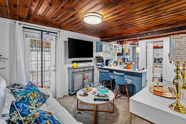 living room with wood ceiling, carpet, and a baseboard heating unit