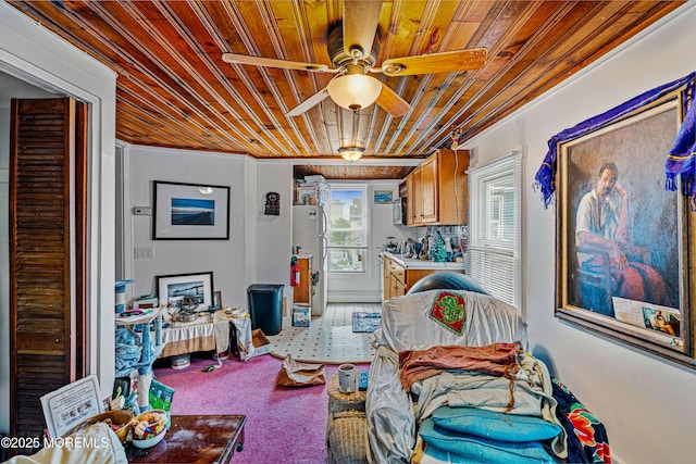 interior space featuring ceiling fan and wood ceiling