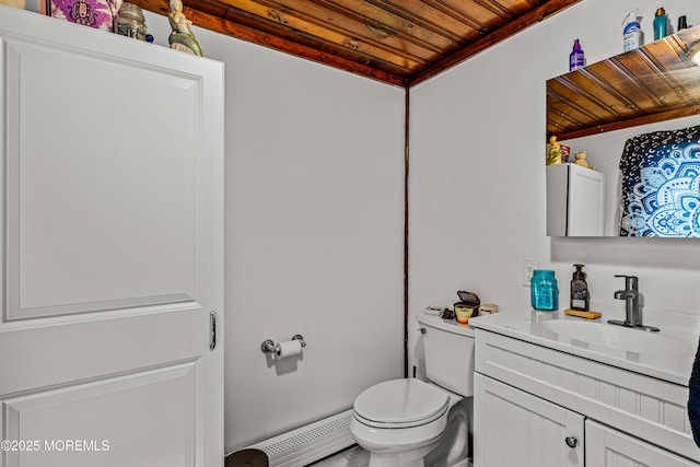 half bathroom with vanity, wooden ceiling, toilet, and a baseboard heating unit