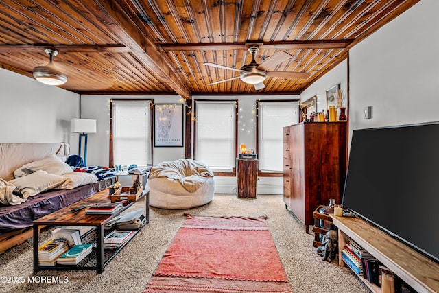 carpeted bedroom with beamed ceiling and wooden ceiling