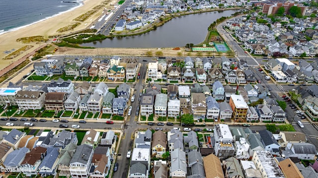 bird's eye view with a water view and a residential view