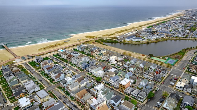 aerial view featuring a water view, a residential view, and a view of the beach