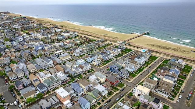 aerial view with a water view and a view of the beach