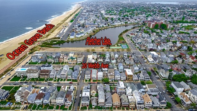 bird's eye view with a water view and a residential view