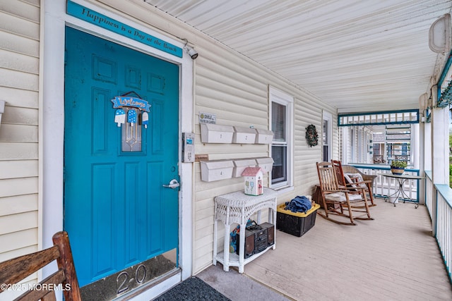 entrance to property with a porch