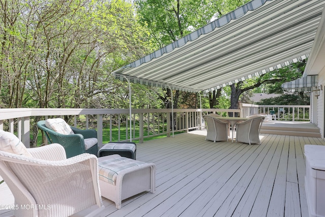 deck featuring outdoor dining area