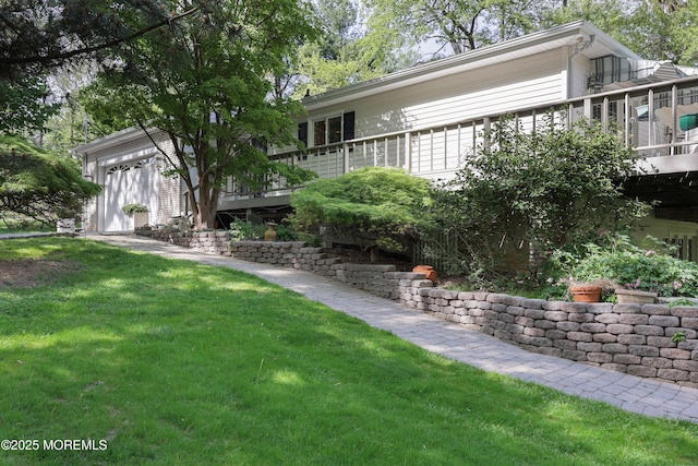 view of yard with a deck and a garage