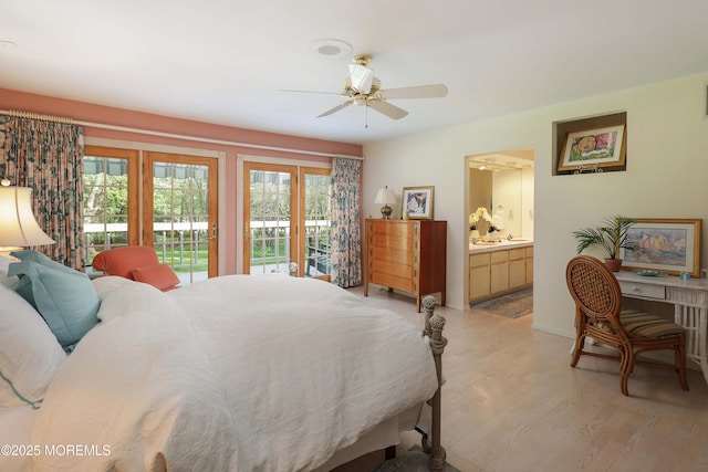 bedroom with multiple windows, ensuite bath, access to outside, and light wood-style flooring