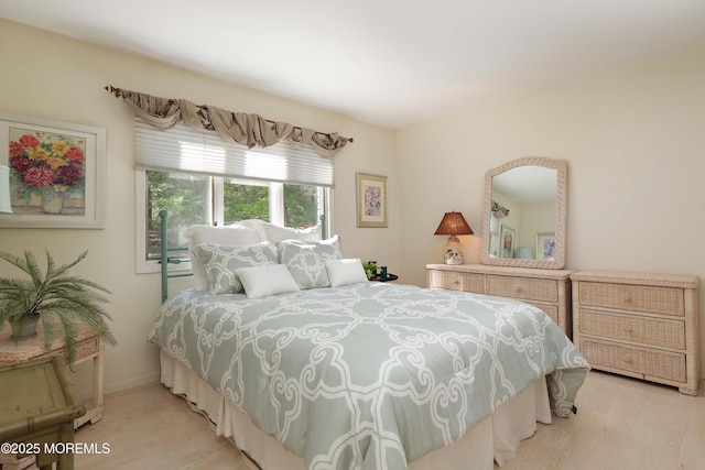 bedroom with light wood-type flooring