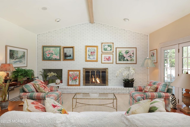 living room featuring a fireplace and vaulted ceiling with beams