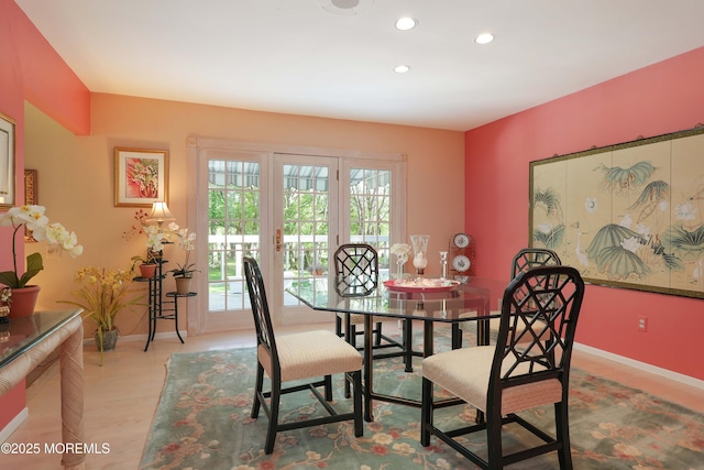 dining area featuring wood finished floors, baseboards, and recessed lighting