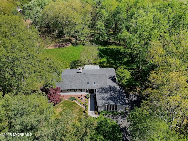 aerial view featuring a wooded view
