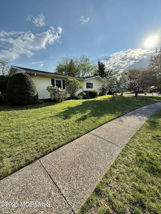 view of front of home with a front lawn