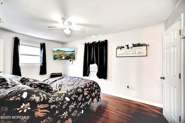 bedroom with baseboards, a ceiling fan, and wood finished floors