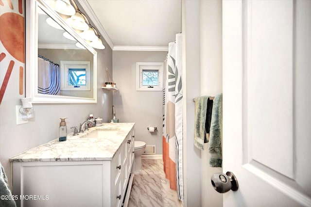 bathroom featuring toilet, marble finish floor, baseboards, visible vents, and ornamental molding