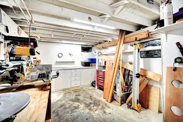 unfinished below grade area with a workshop area