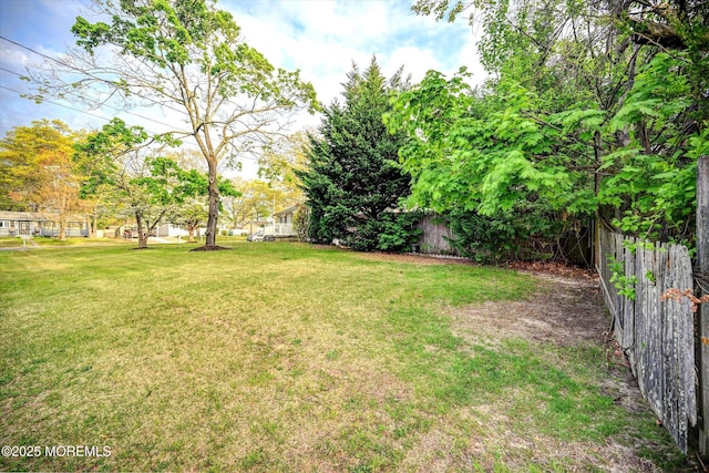 view of yard with fence