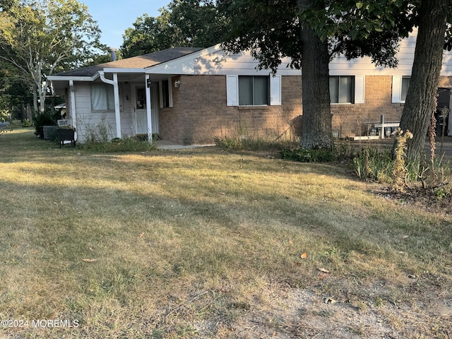 2A Cardinal St, Manchester, NJ 08759 - ranch-style home with a front lawn and brick siding