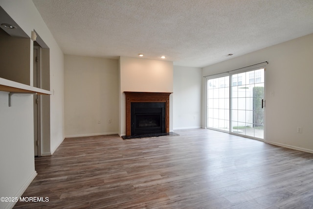 111 Watson Ct, Howell, NJ 07731 - unfurnished living room featuring a fireplace, recessed lighting, a textured ceiling, and wood finished floors