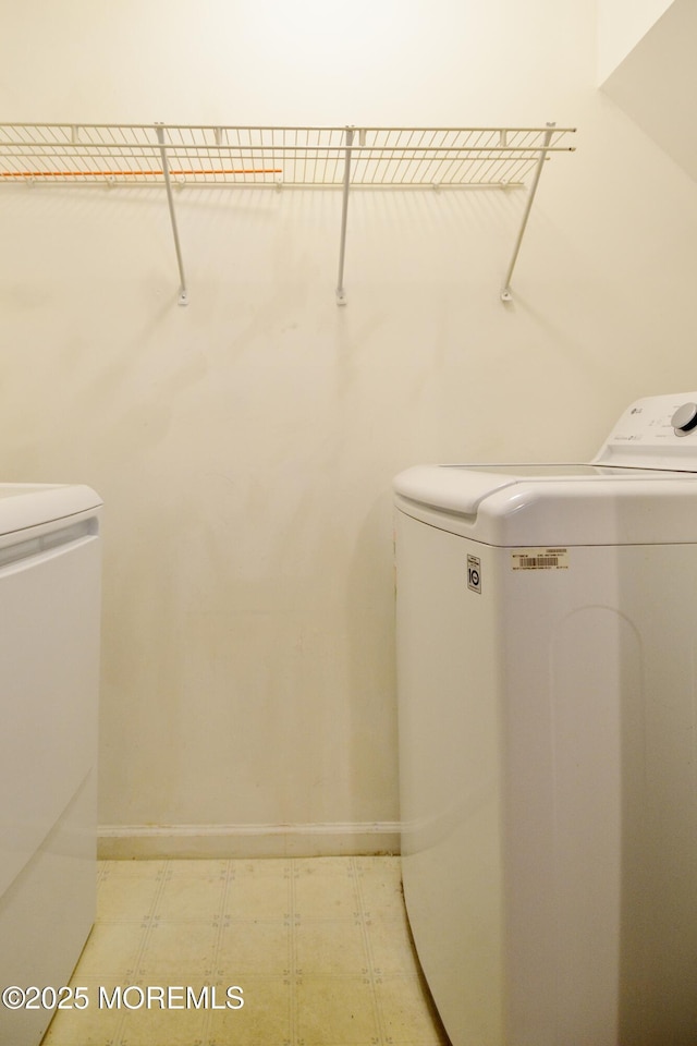 111 Watson Ct, Howell, NJ 07731 - washroom featuring light floors, baseboards, laundry area, and washer and clothes dryer