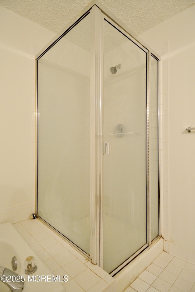 111 Watson Ct, Howell, NJ 07731 - full bath featuring a textured ceiling, a tub to relax in, tile patterned flooring, and a stall shower