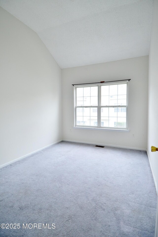 111 Watson Ct, Howell, NJ 07731 - carpeted empty room featuring baseboards, visible vents, and lofted ceiling